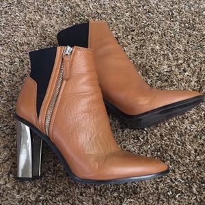 Brown ankle boots with chrome color heel